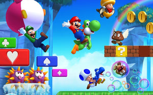 Mario på Yoshi, Luigi och Toad bland mynt och block i en färgglad bana
